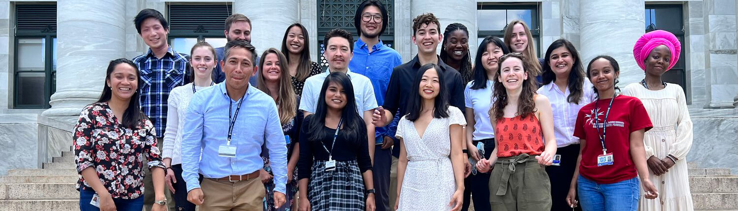 Group of people standing on stairs outside