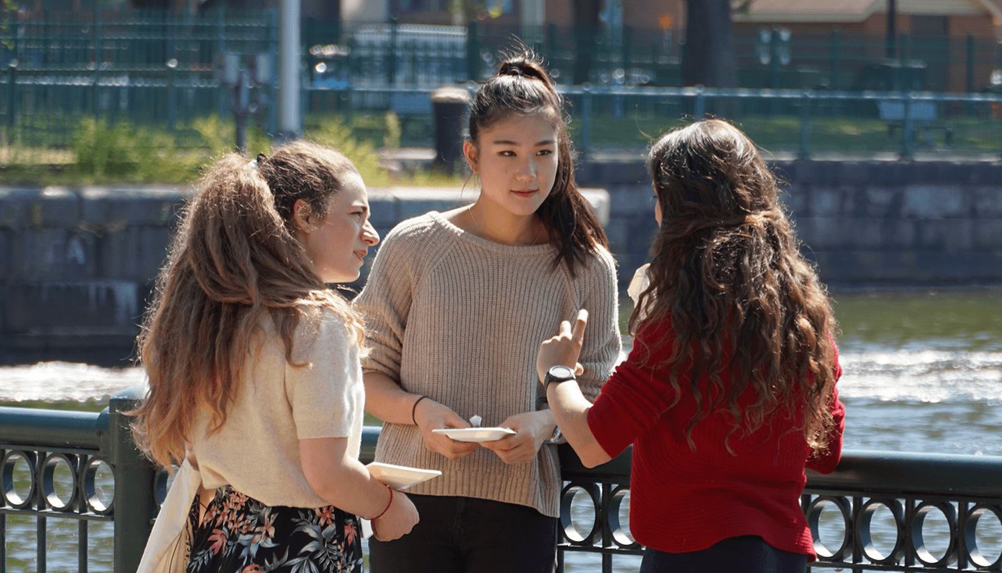 A group of department members in conversation.