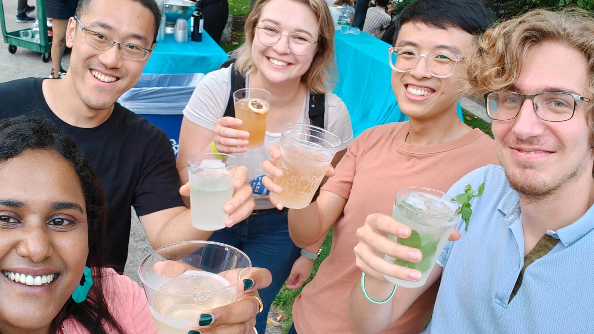 A group of people holding drinks