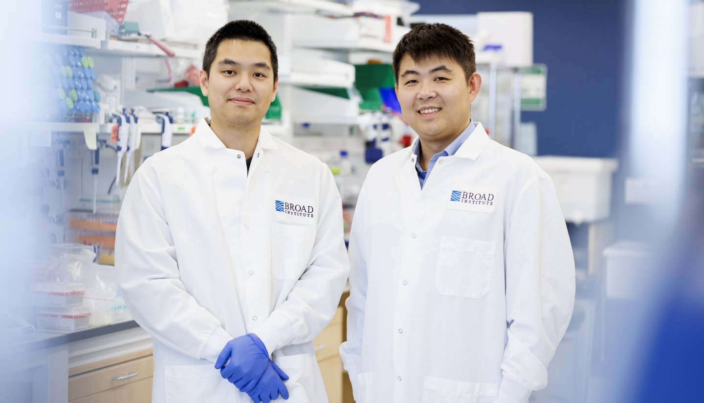 Graduate student Kevin Yu-Kai Chao (left) and Professor Fei Chen (right) pose in lab coats